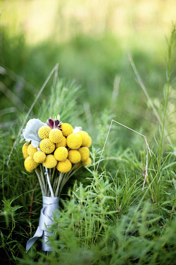yellow bouquet detail in grass - wedding photo by top Atlanta based wedding photographers Scobey Photography